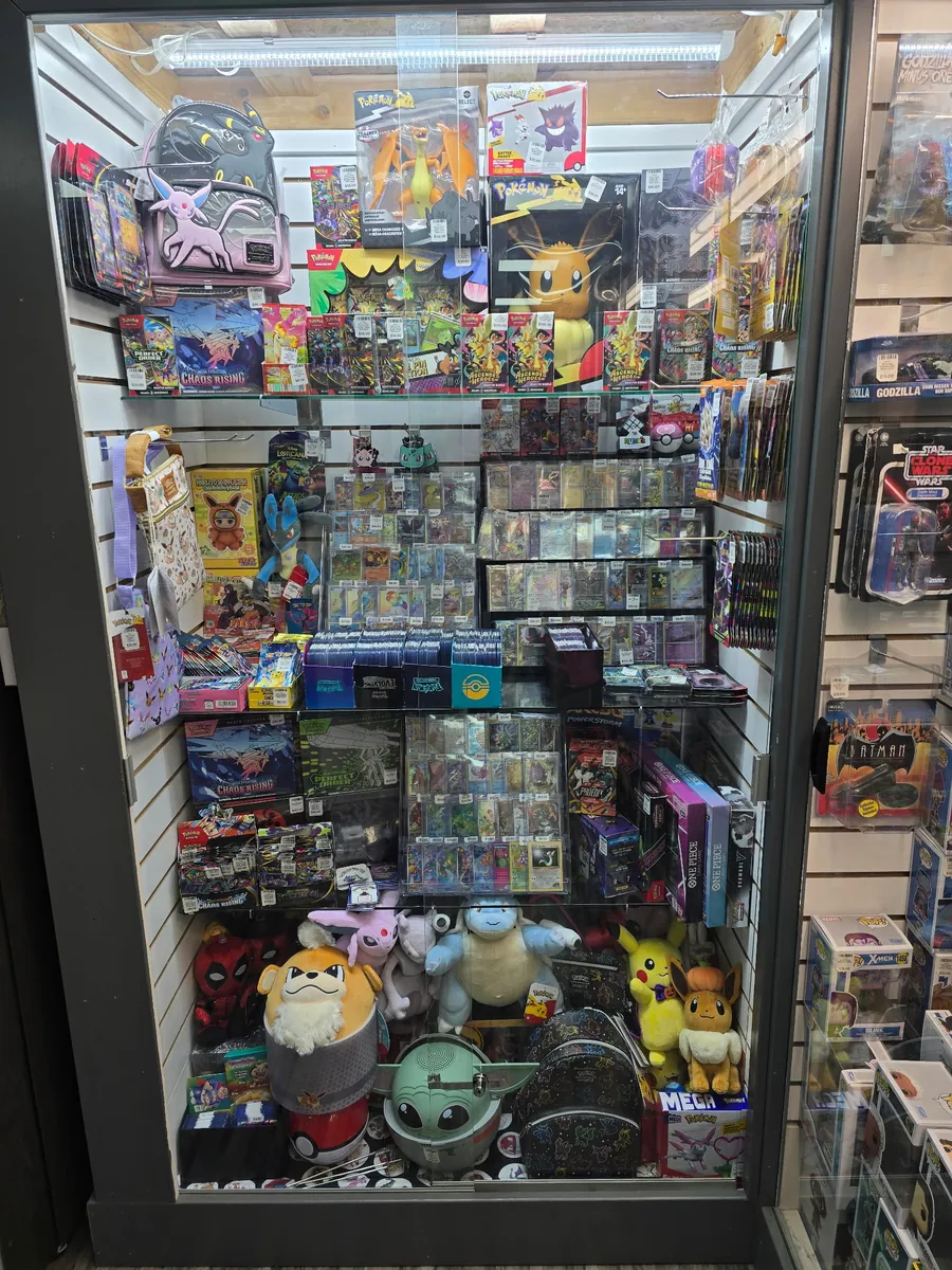 Pokémon cards, sealed products, plush, and collectibles displayed inside Professor Tero Collectibles